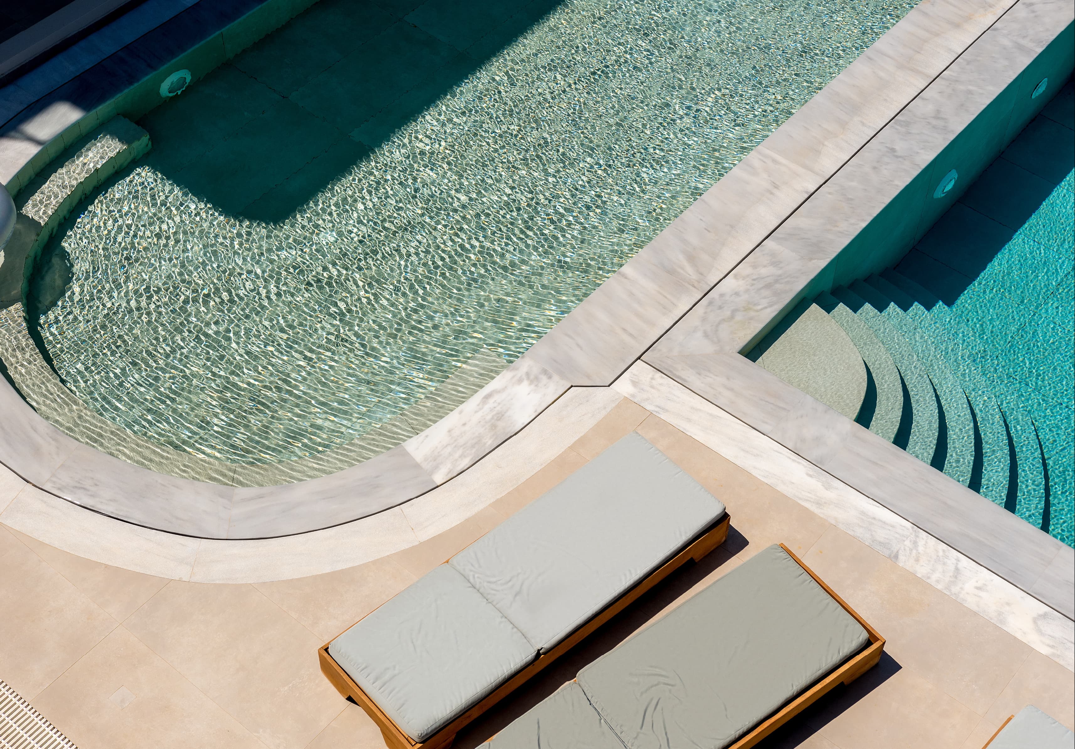 Zayed Villa — pool, loungers and travertine deck